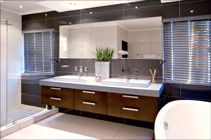 Better Kitchens supplied and manufactured the stylish vanities for this chic bathroom. With a stained beech veneer, which was matched with Caesarstone countertops, the vanities add the luxurious finishing touches to this space.Better Kitchens specialises in upmarket kitchens as well as vanities, bars, built-in cupboards, custom-built furniture and shopfitting.On Tap Alberton has the expertise to understand that there is more to a bathroom than what meets the eye. Therefore the company sources the best possible bathroom, kitchen and plumbware. Not only does On Tap offer quality products such as Cobra, but it offers expert advice to help clients make the right choice as well.