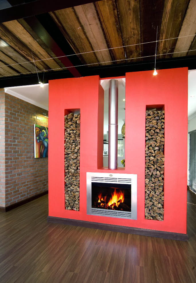 Home Fires ( 011 663 3911)This double-sided vent-free built-in gas fireplace, supplied by Home Fires, was installed into this beautiful setting with a mock chimney. The popular stainless steel appeal makes this a winner in every modern home. Double-sided fireplaces also come in units using real wood.