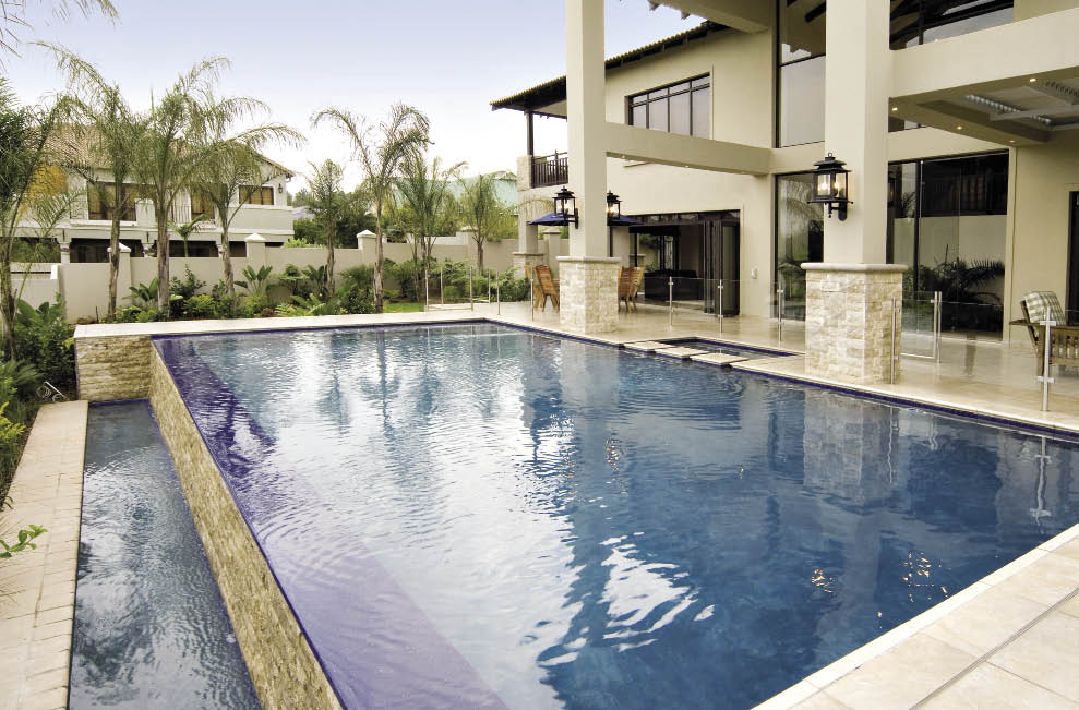 HIPPO POOLS (011 973 3724)Hippo Pools constructed this gunite swimming pool that comes complete with a vanishing edge which doubles up as a feature. The pool was finished off with midnight blue marble plaster, and royal blue mosaic tiles were laid on the edge to add that extra bit of distinct splendour. 