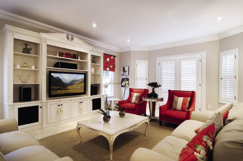 Country style interiors(011 9032 9408)This exquisite TV unit is also available in supawood and in a hand-painted finish to carry through the same look as the kitchen. Beautiful traditional detailing such as pilasters, pediment with urn detail and fluted fascias, provide a modern appeal. The unit was specifically designed to be spacious and house the family’s sound equipment.